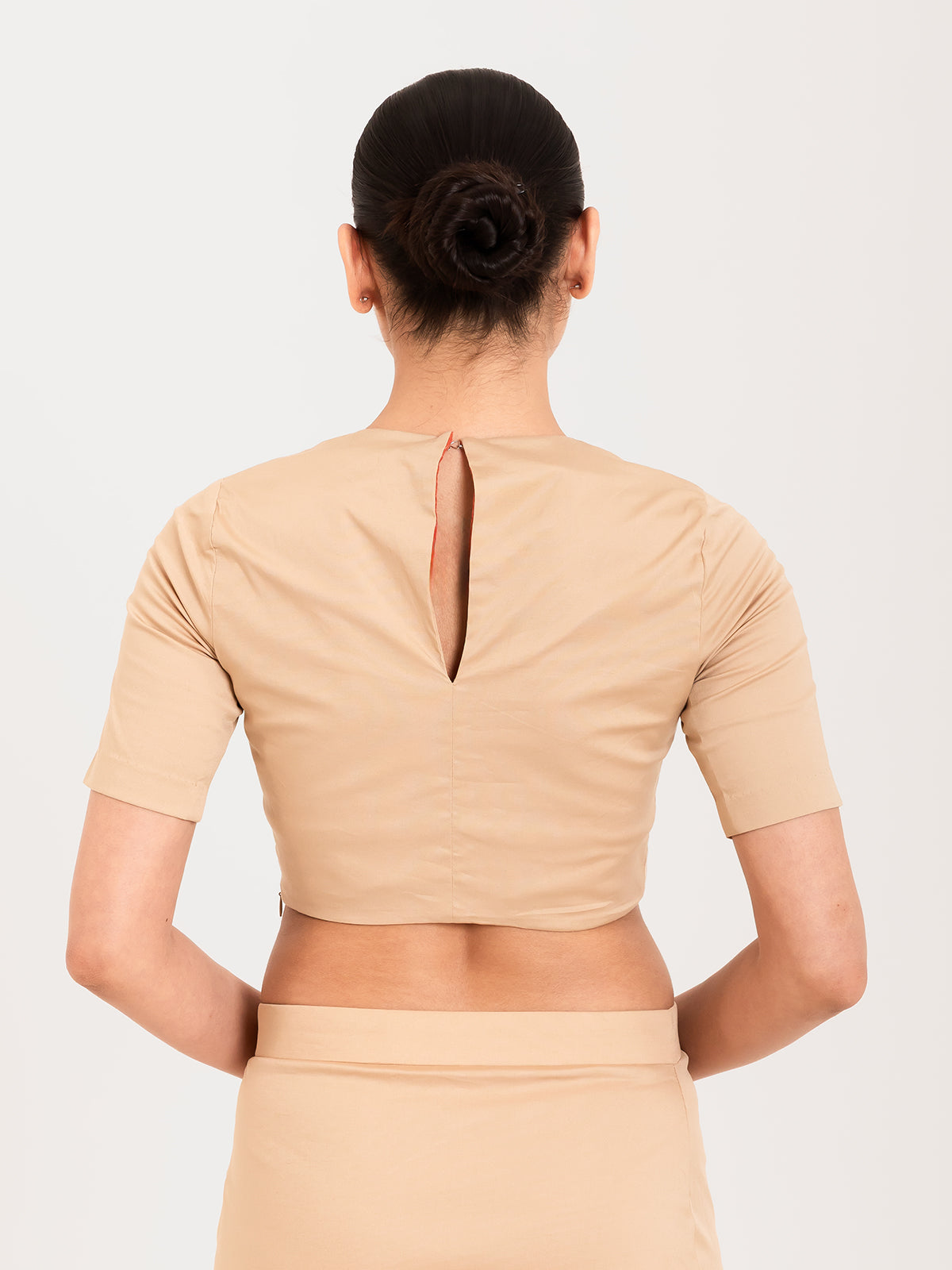 Beige cotton lycra round neck sleeveless blouse