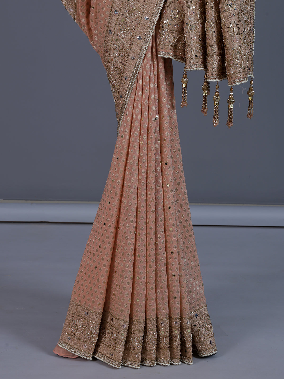 Peach dola silk saree with elegant tassel pallu