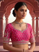 Rani pink bridal raw silk lehenga choli with embellished dupatta