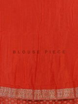 Rust orange premium dola silk saree with elegant zari artistry