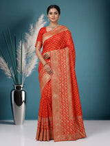 Rust orange premium dola silk saree with elegant zari artistry
