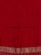 Maroon royal dola silk saree with ornate zari woven border