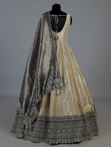 Ivory silk sleeveless anarkali salwar suit with elegant dupatta