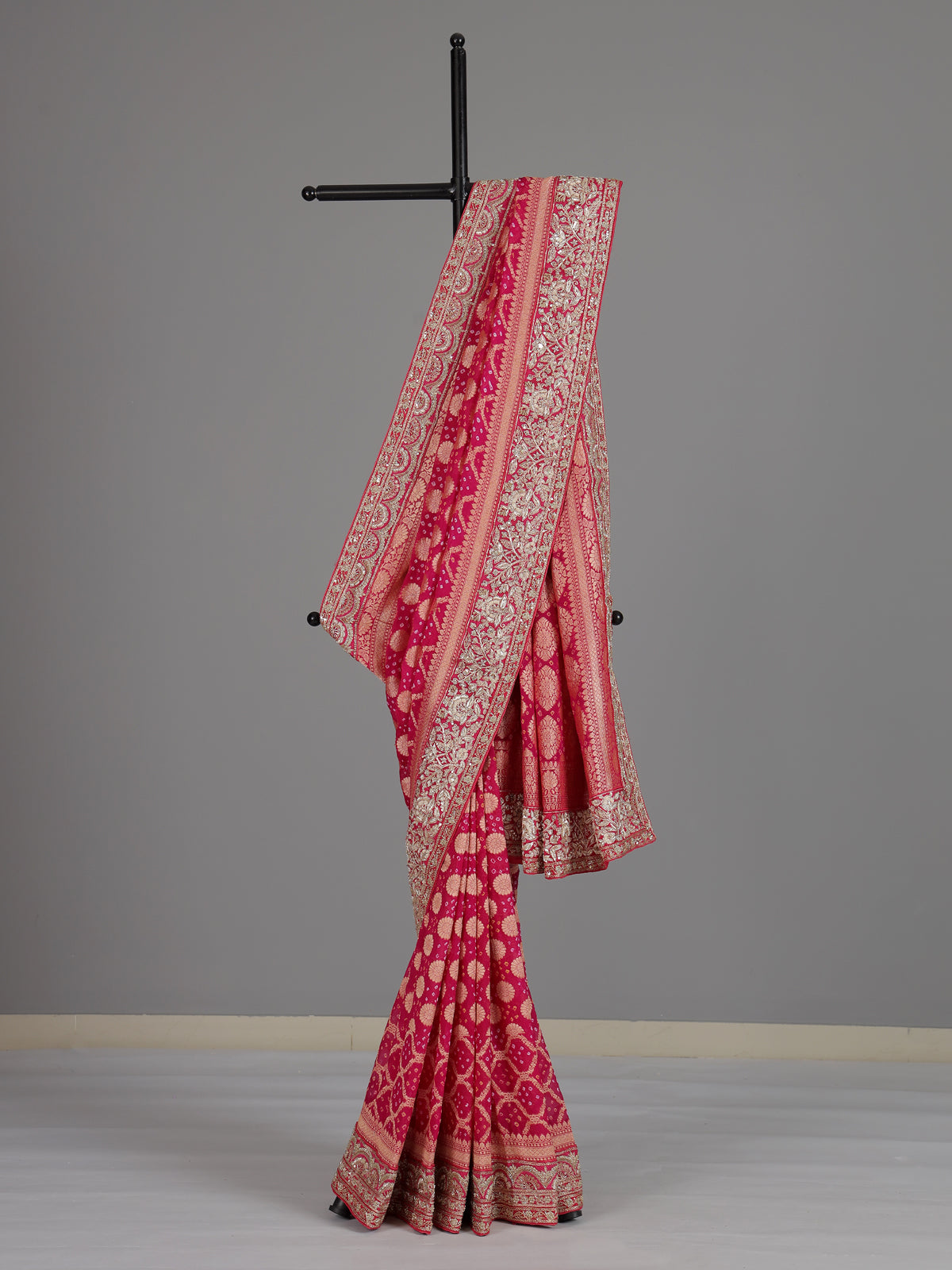 Rani pink georgette designer saree with festive elegance