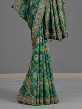 Green bandhej dola silk saree with traditional festive elegance
