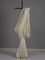 Off white tissue dola silk saree with timeless festive elegance
