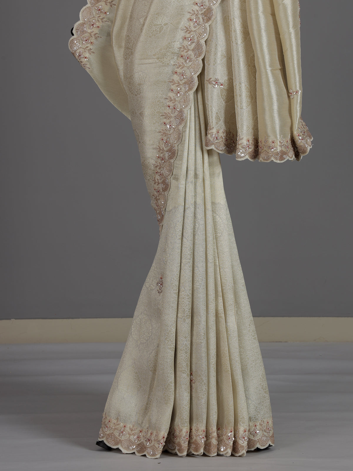 Off white tissue dola silk saree with timeless festive elegance