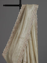 Off white tissue dola silk saree with timeless festive elegance