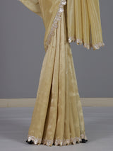 Classic cream tissue silk saree for party and reception wear