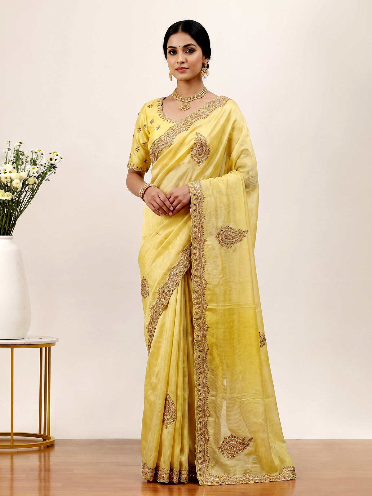 Traditional yellow shaded dola shimmer saree for haldi ceremony