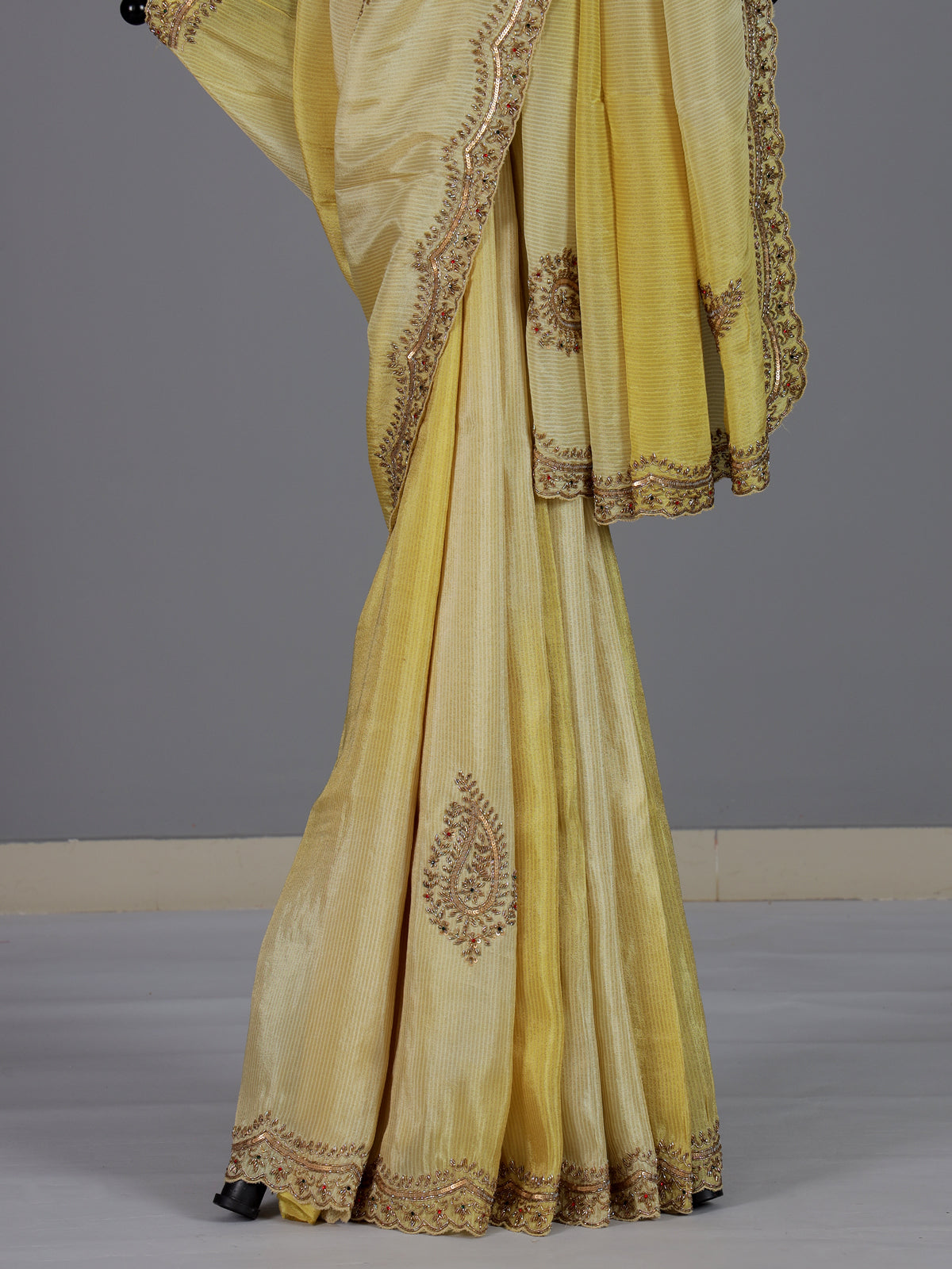 Traditional yellow shaded dola shimmer saree for haldi ceremony