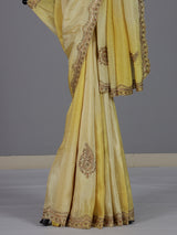 Traditional yellow shaded dola shimmer saree for haldi ceremony
