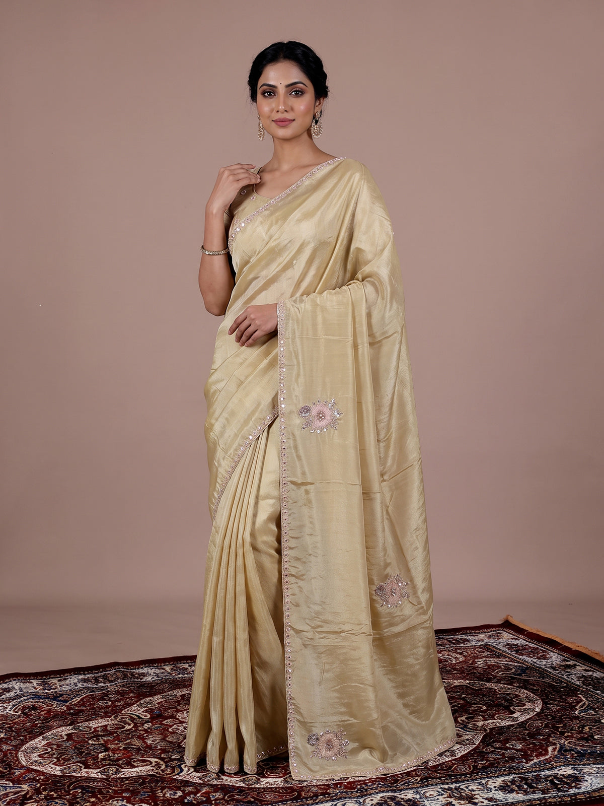 Cream shimmer dola silk festive saree with elegant handcrafted detailing
