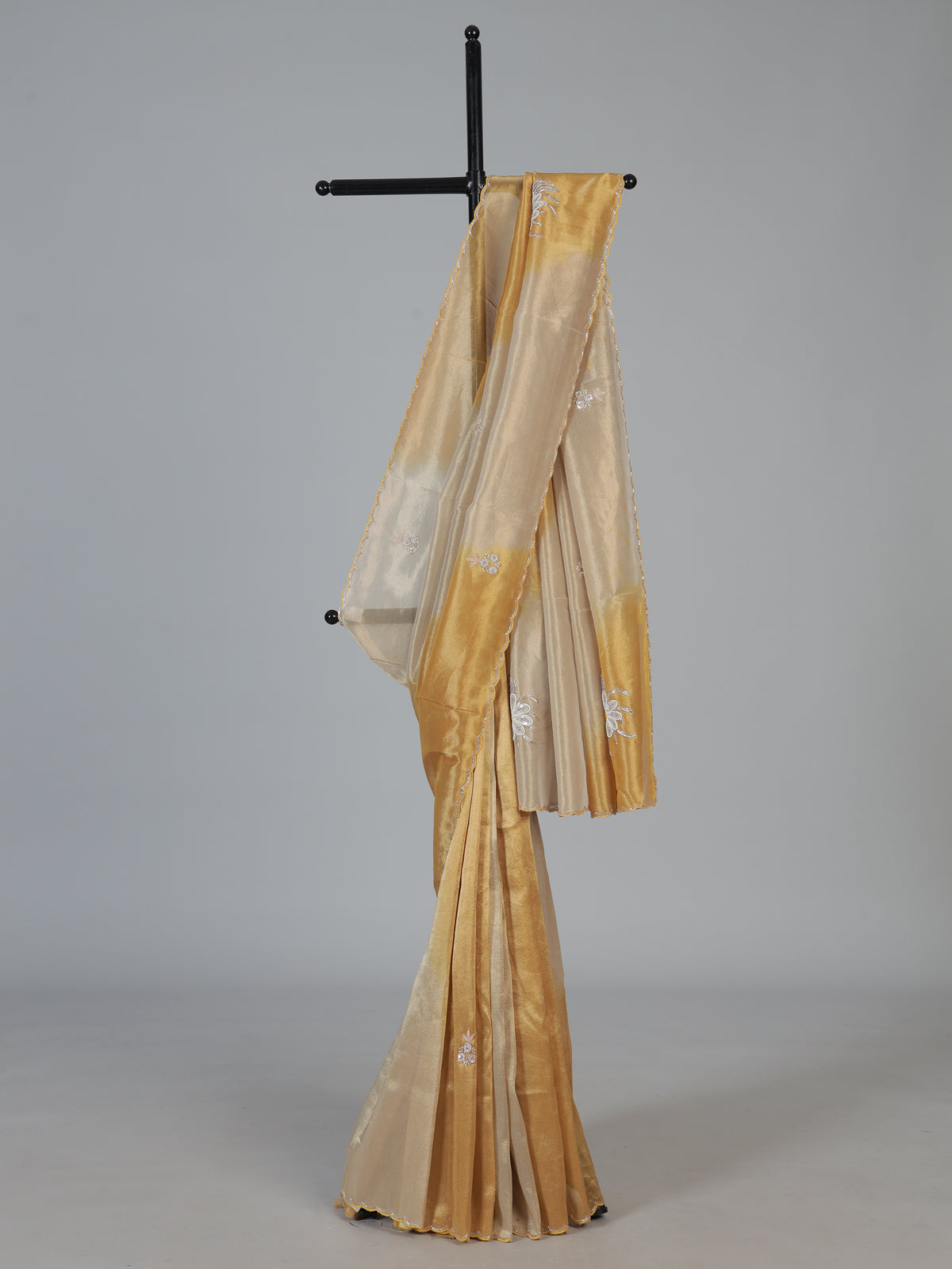 Golden and beige tissue silk festive saree with luxurious embellishments