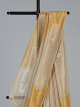 Golden and beige tissue silk festive saree with luxurious embellishments