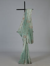 Pista green shimmer dola silk saree with elegant festive embellishments