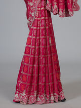 Rani pink bandhani dola silk saree with luxurious festive elegance