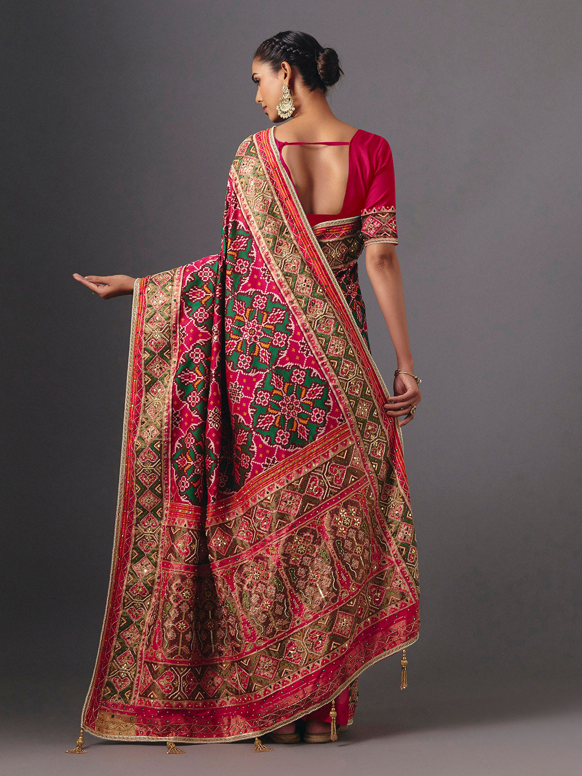 Rani pink art patola silk saree with graceful traditional elegance