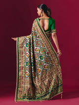 Green art patola silk saree with animal and bird motif artistry