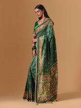 Green art silk patola print saree with timeless festive elegance