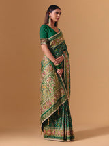 Green art silk patola print saree with timeless festive elegance
