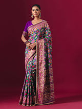 Purple and green art patola silk saree with festive motifs