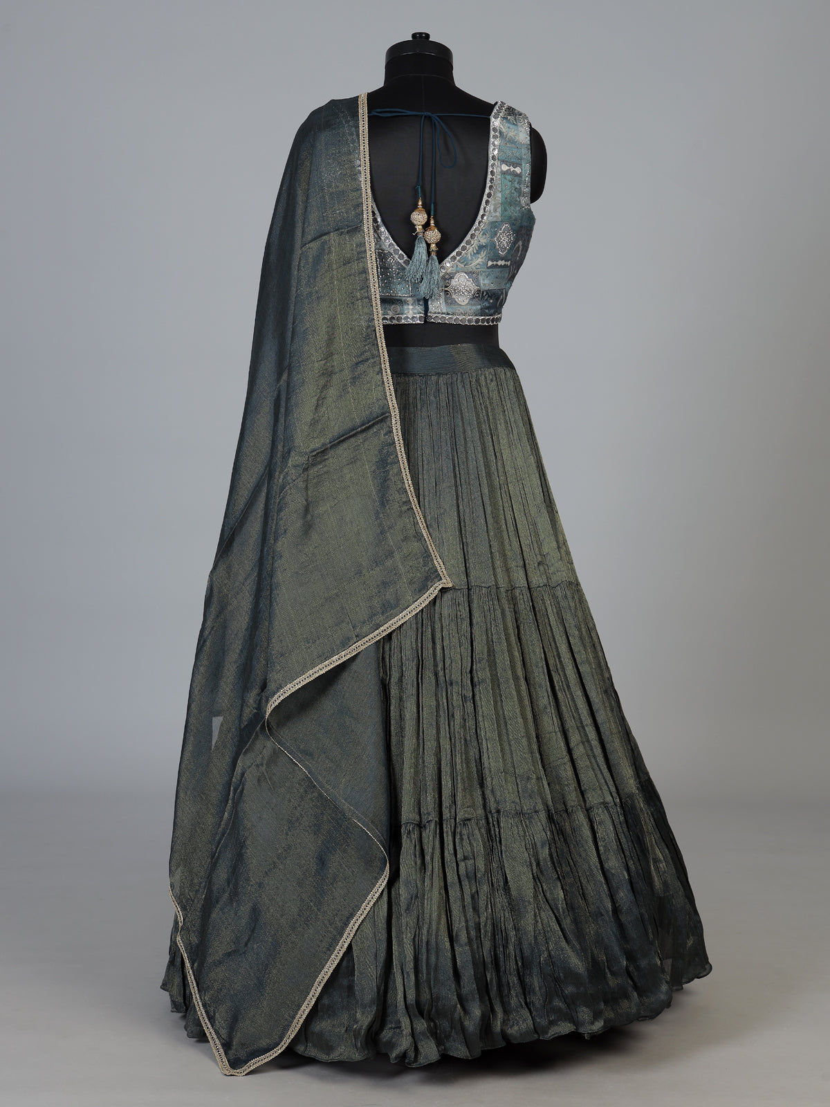 Bottle green tiered crepe silk designer lehenga creation