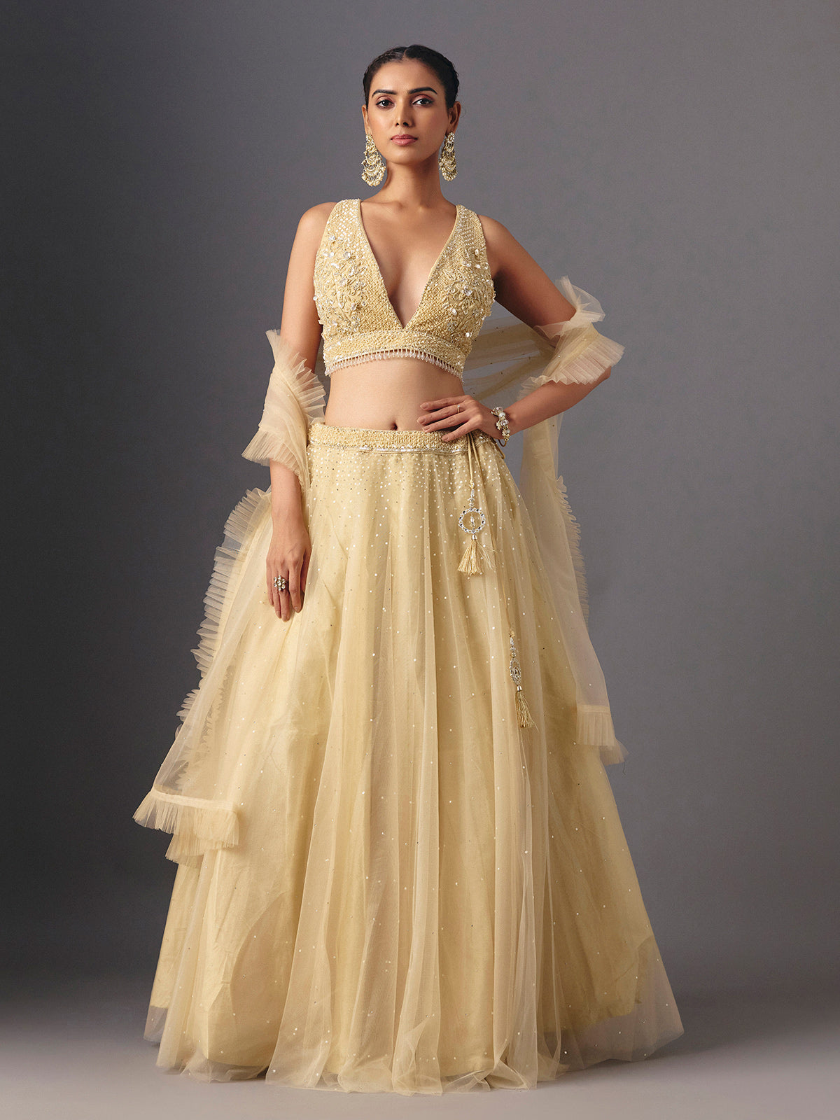 Yellow net designer lehenga choli with elegant dupatta for celebrations