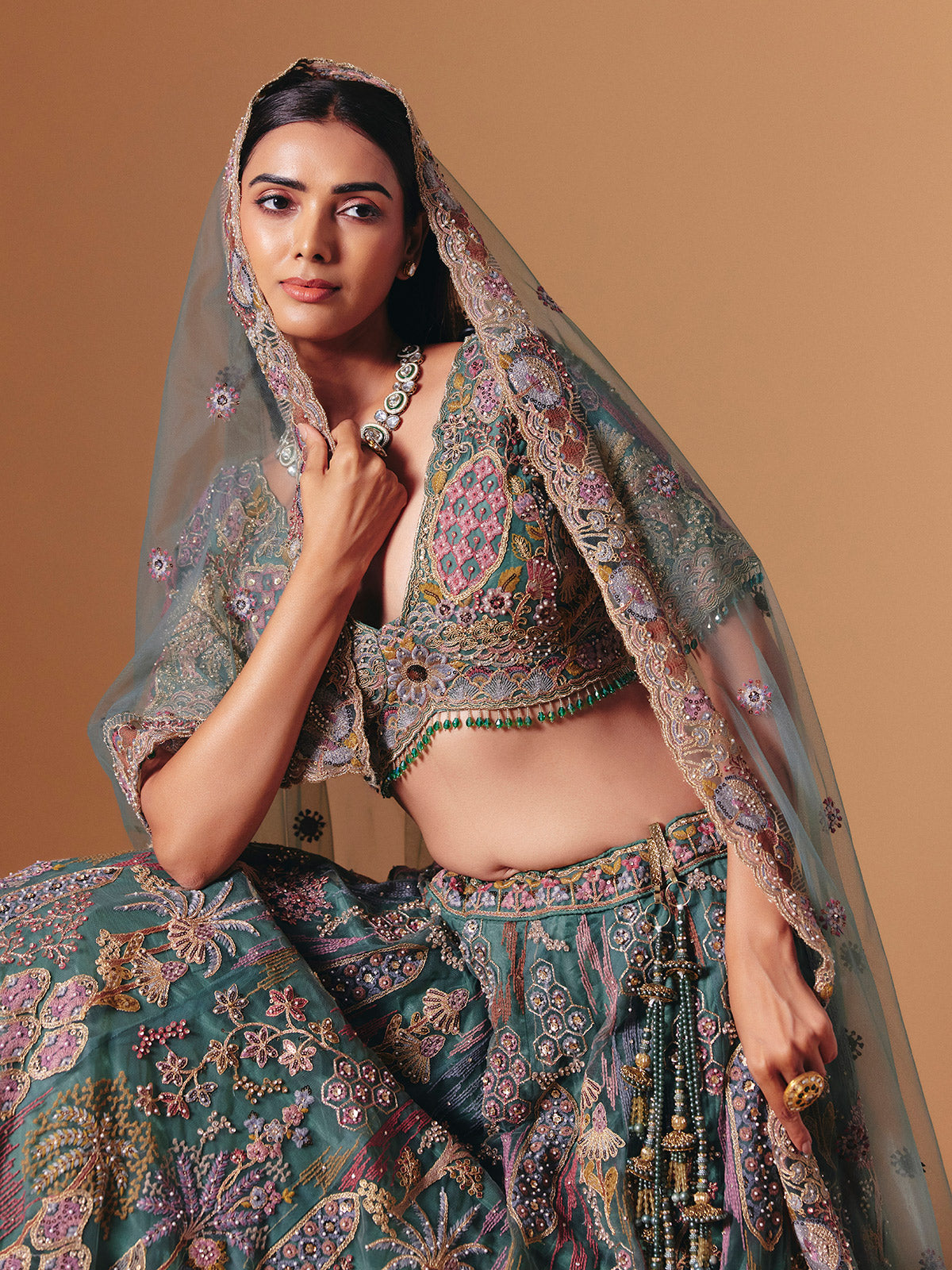 Teal green net designer lehenga choli with elegant dupatta grace