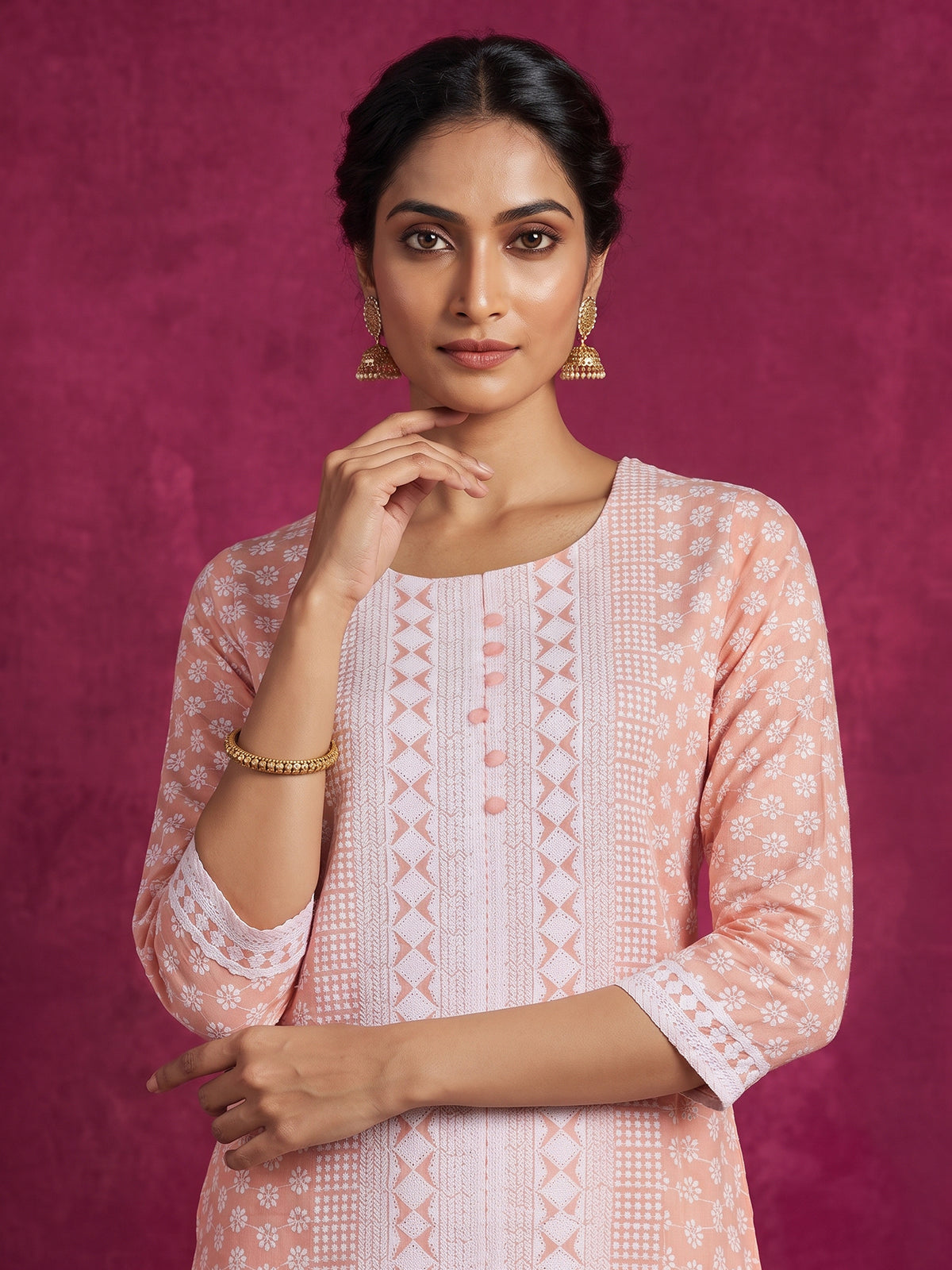 Peach chikan kurti with embroidery and elegant round neckline