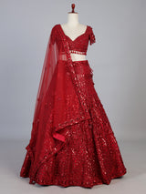 Maroon net designer lehenga choli with stone work tassel detailing