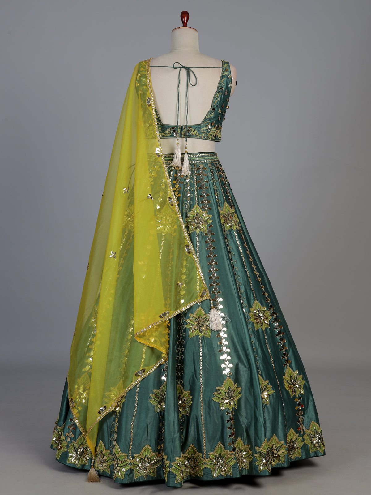 Green silk lehenga choli with mirror patchwork and contrast dupatta