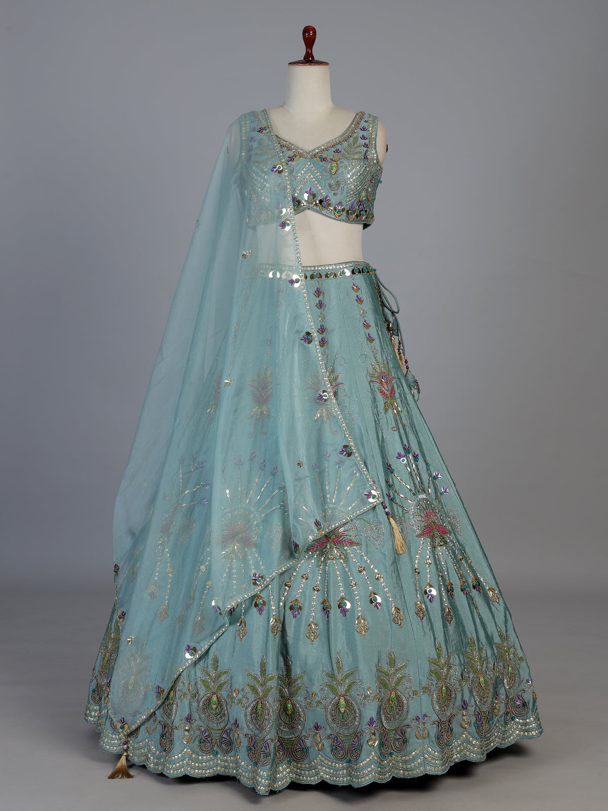 Light blue silk lehenga choli with pearls mirrors and zardosi work