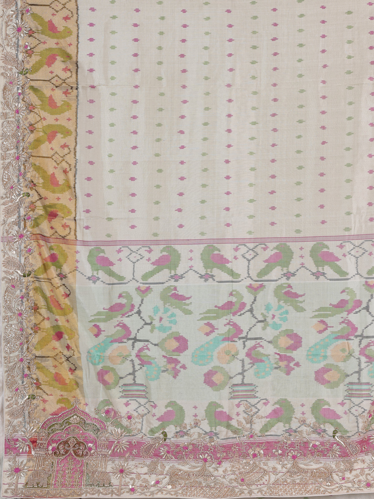 Cream patola silk saree with peacock motif contrast border and pallu