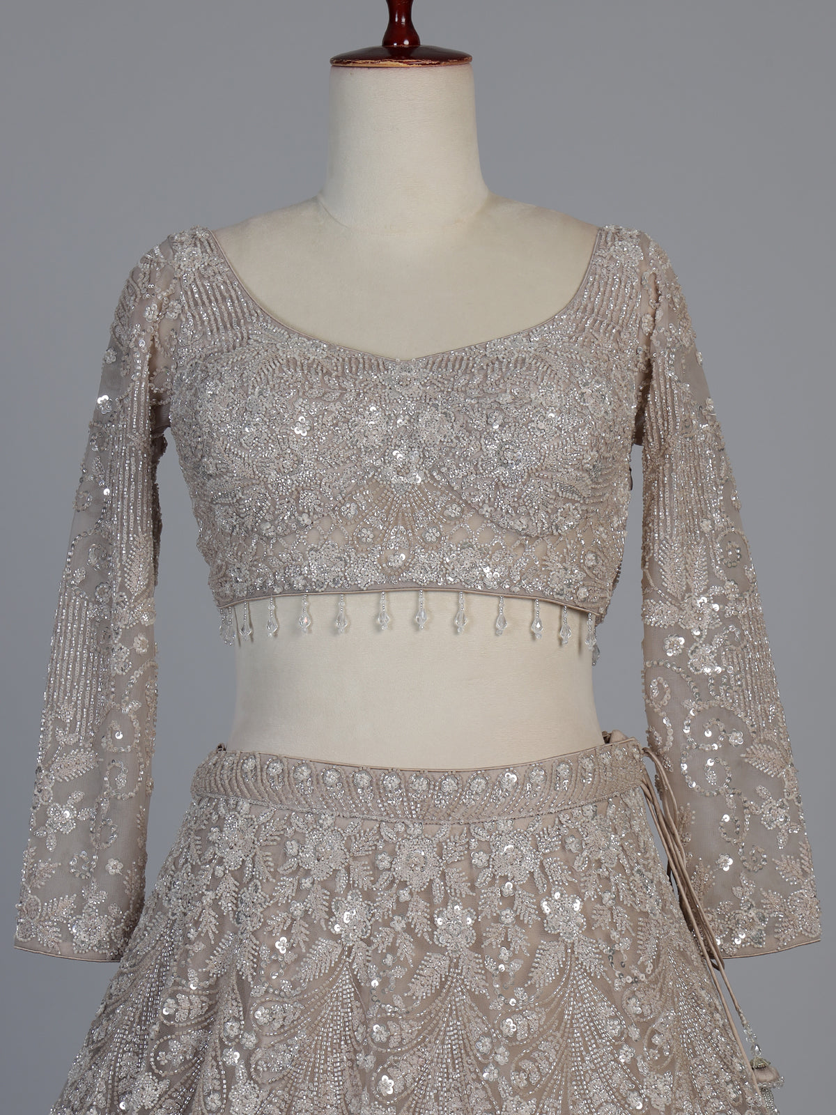 Beige net sequins embellished party lehenga choli