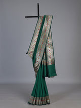Green paithani silk saree with floral motifs and rich zari