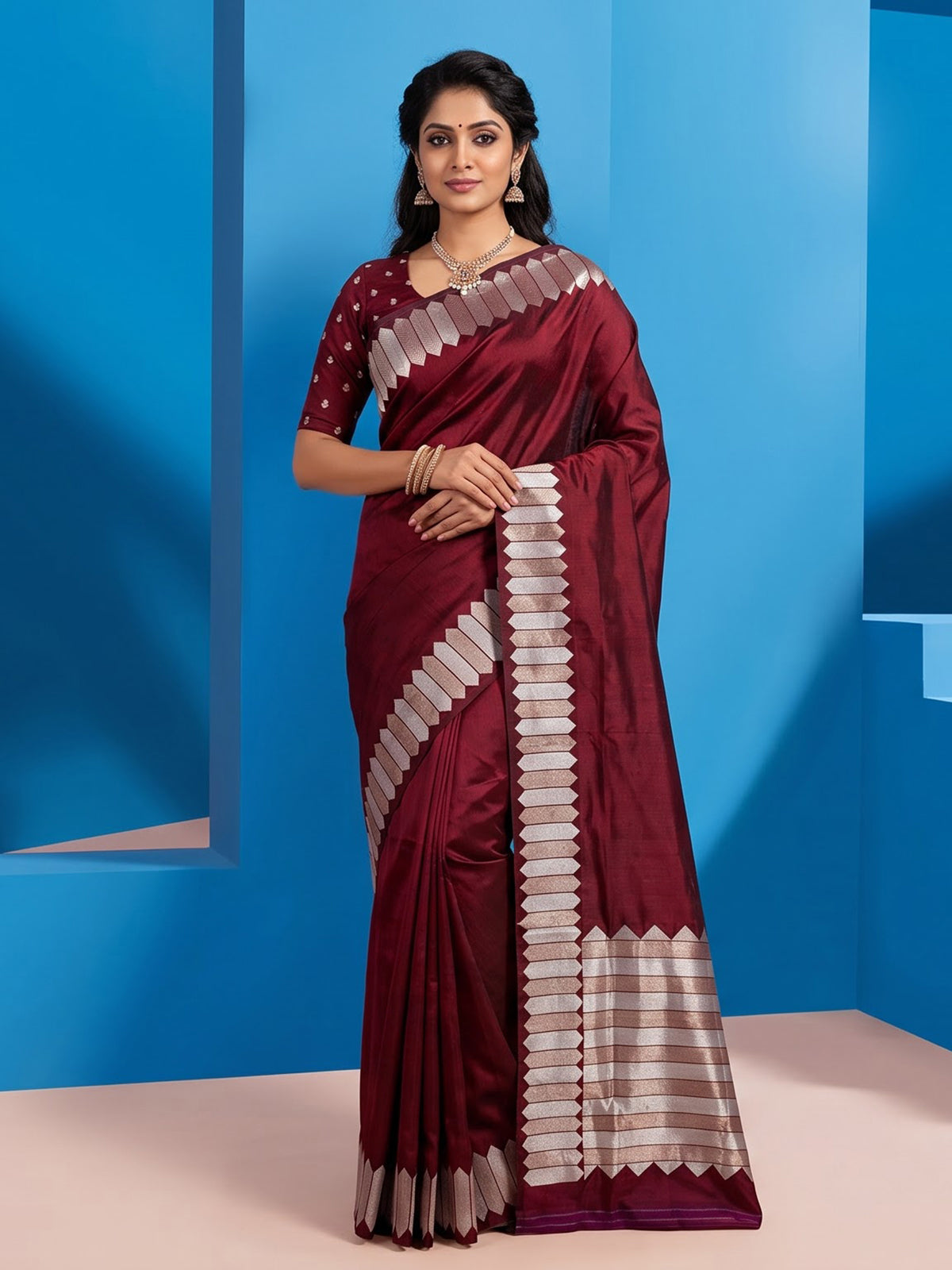 Maroon satin silk saree with elegant zari border and pallu