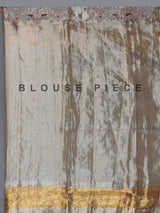 Pastel beige tissue silk saree with bird motif