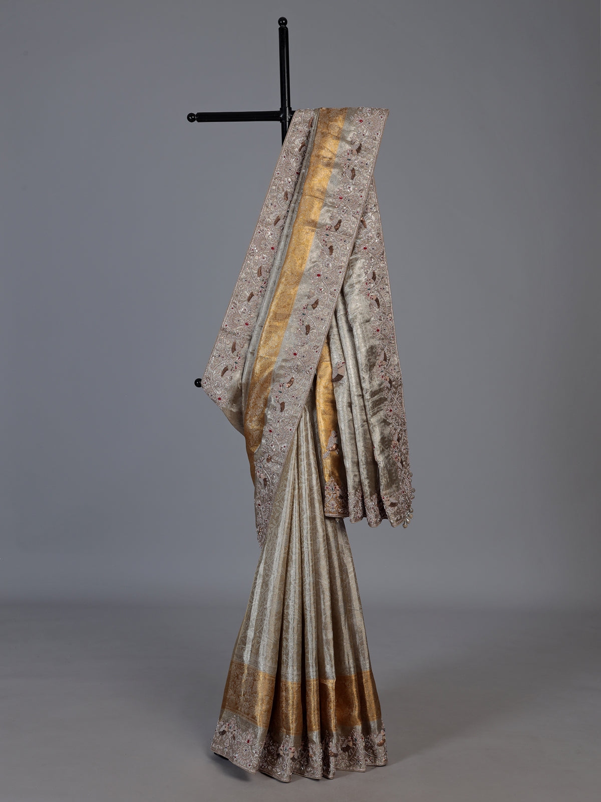 Pastel beige tissue silk saree with bird motif