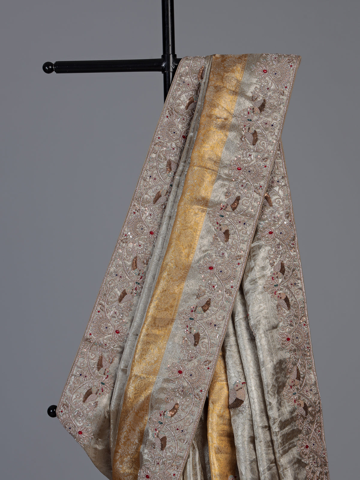 Pastel beige tissue silk saree with bird motif