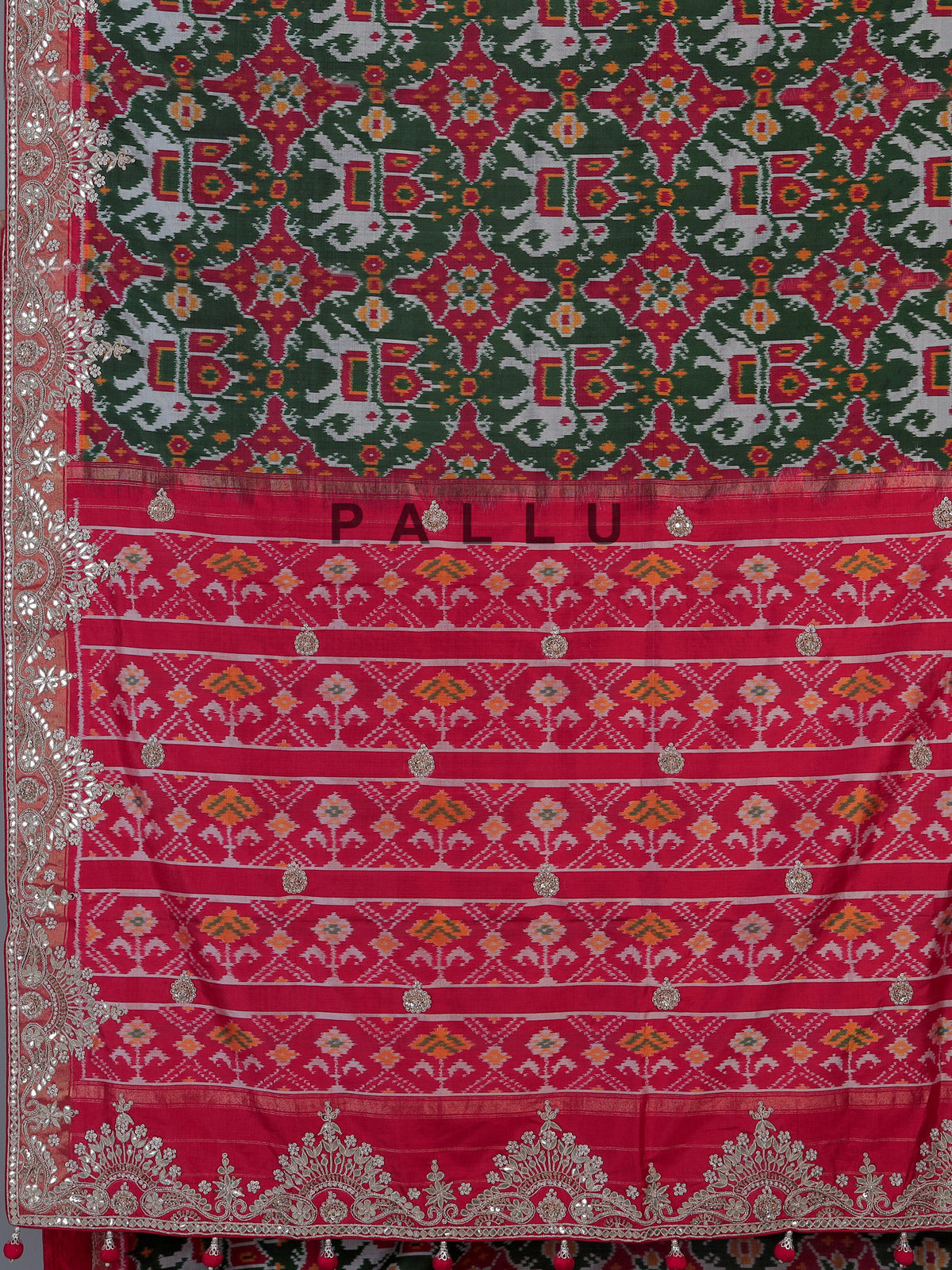 Green Hyderabadi patola silk saree with traditional contrast border