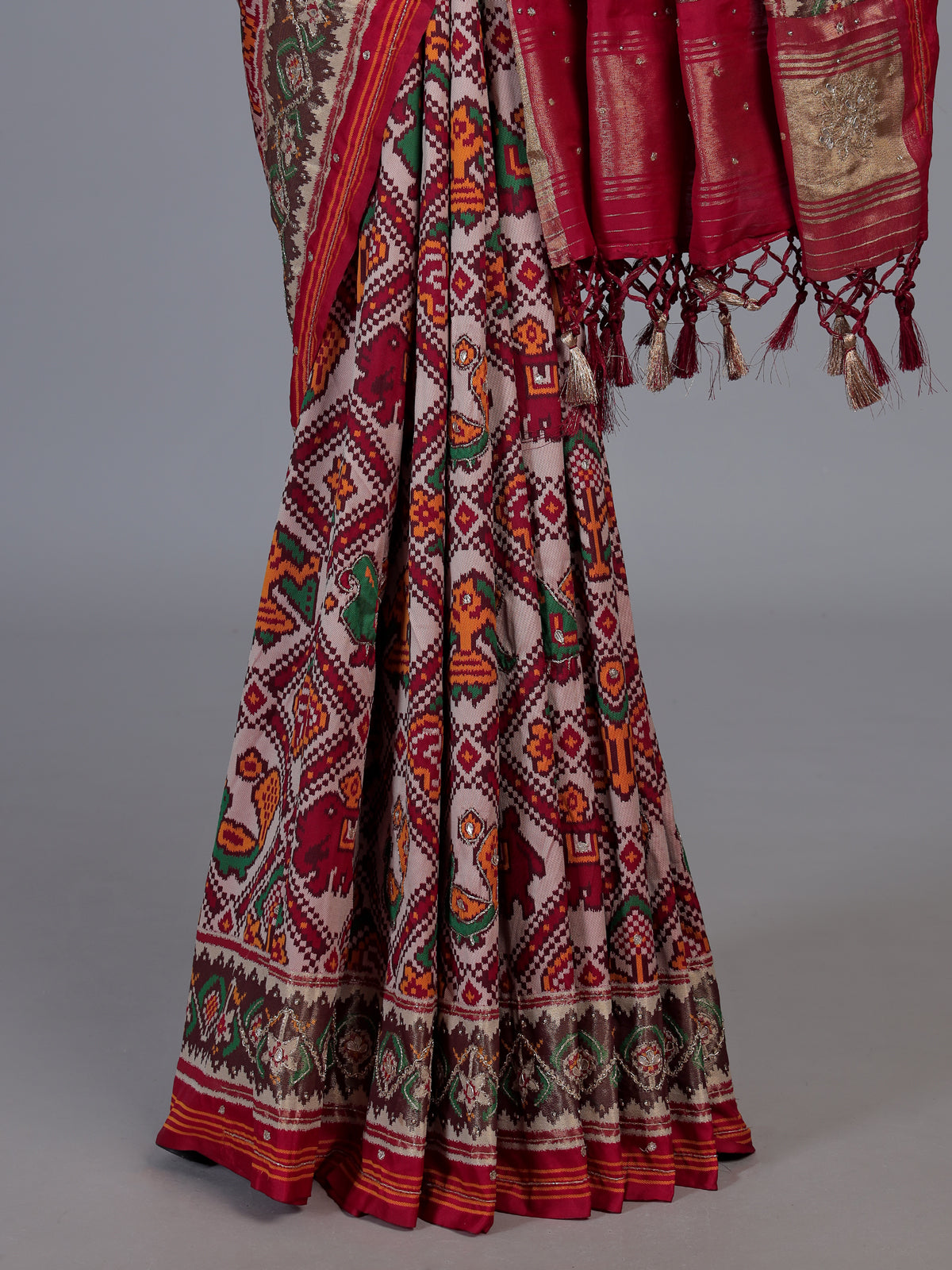 Red art patola silk saree with exquisite handcrafted embellishments