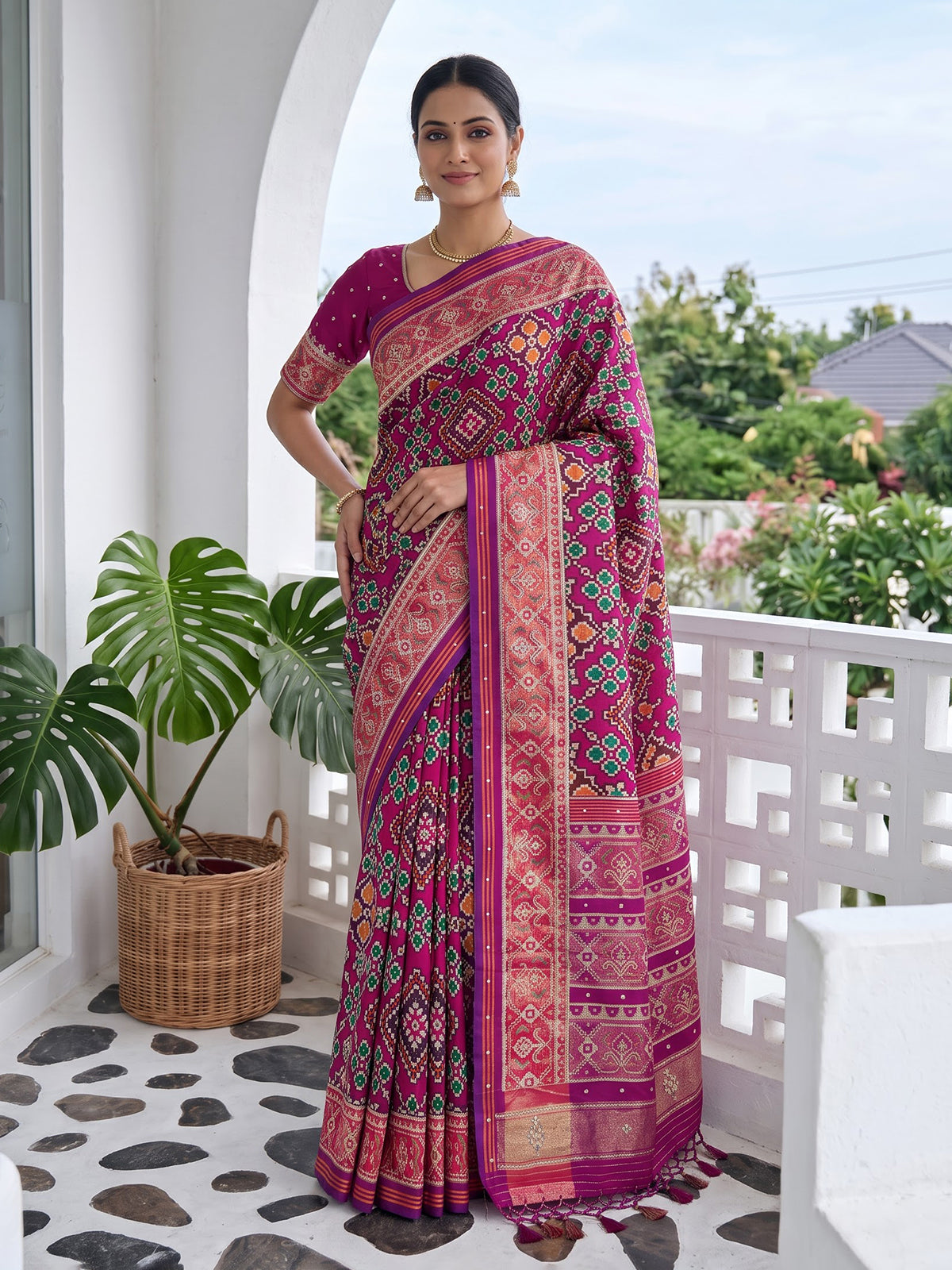 Magenta art patola silk saree with stone embellished elegance