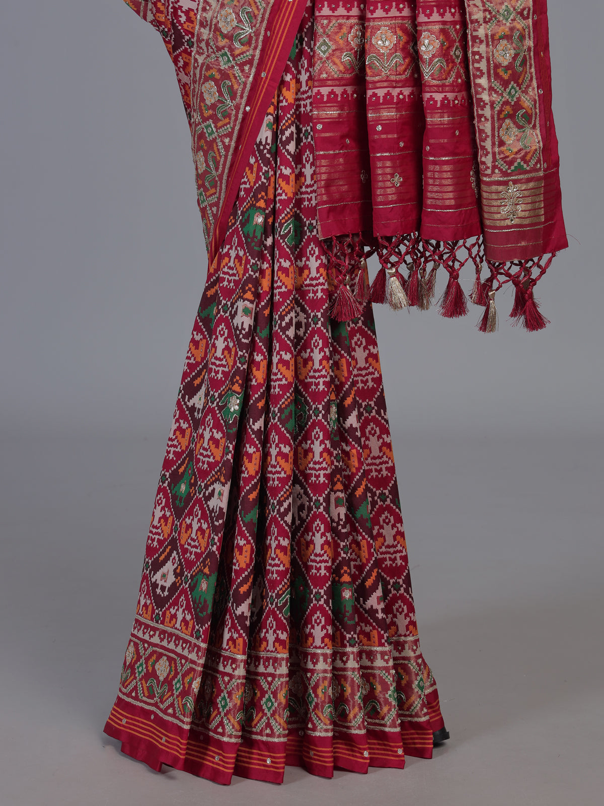 Red art patola silk saree with elegant stone work