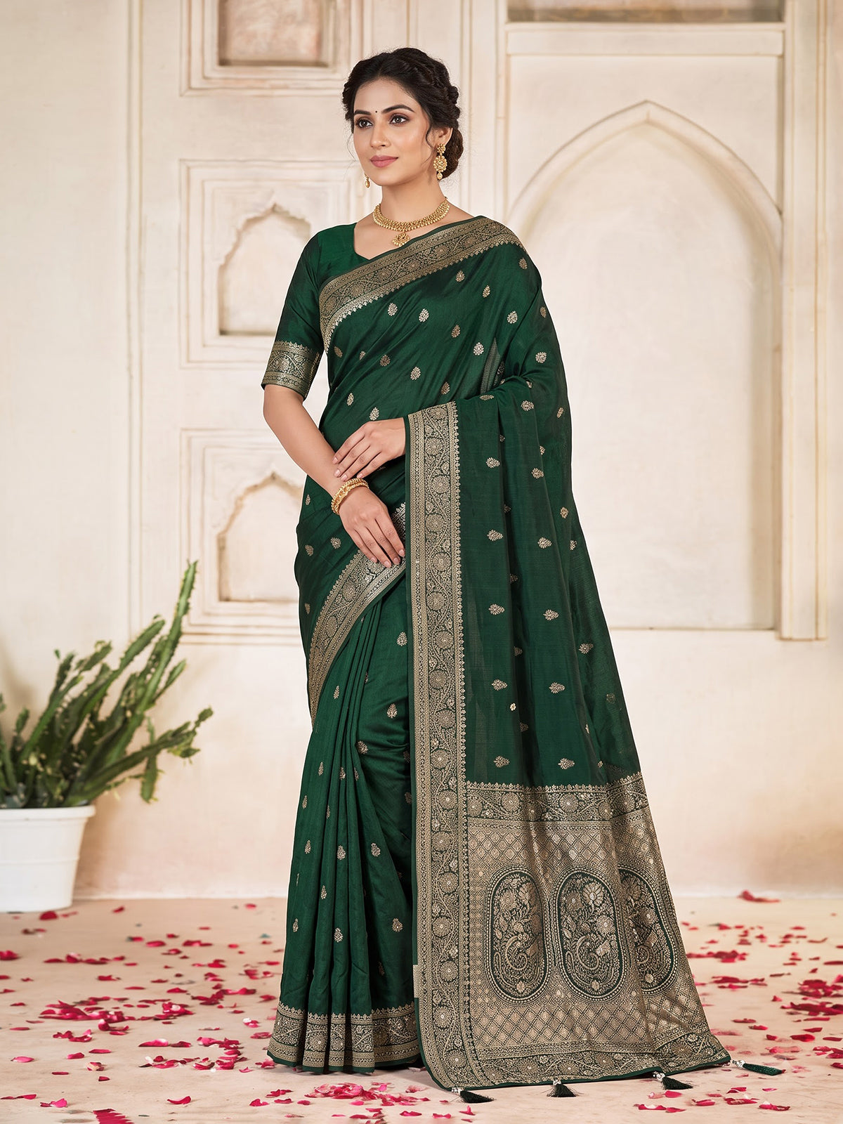 Green dola silk saree with rich butti elegance