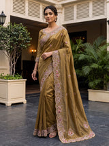 Gold tissue silk saree with bird motif border embellishments