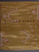 Gold tissue silk saree with bird motif border embellishments