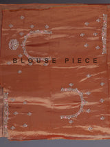 Pastel orange tissue silk saree with elephant border festive elegance