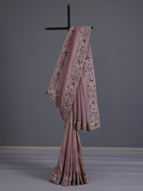 Pastel pink shimmer tissue saree with peacock border designer elegance
