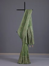 Pastel pista green shimmer dola silk saree with peacock motifs